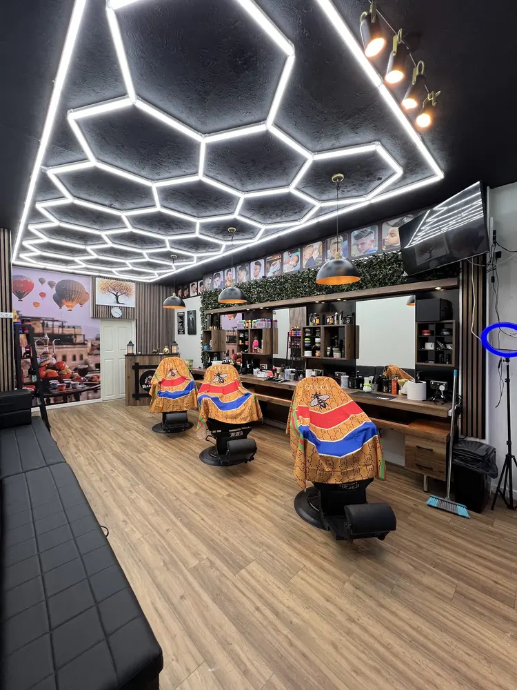 Inside Cappadocia Barber: hexagon lights, wood panelling and three barber chairs